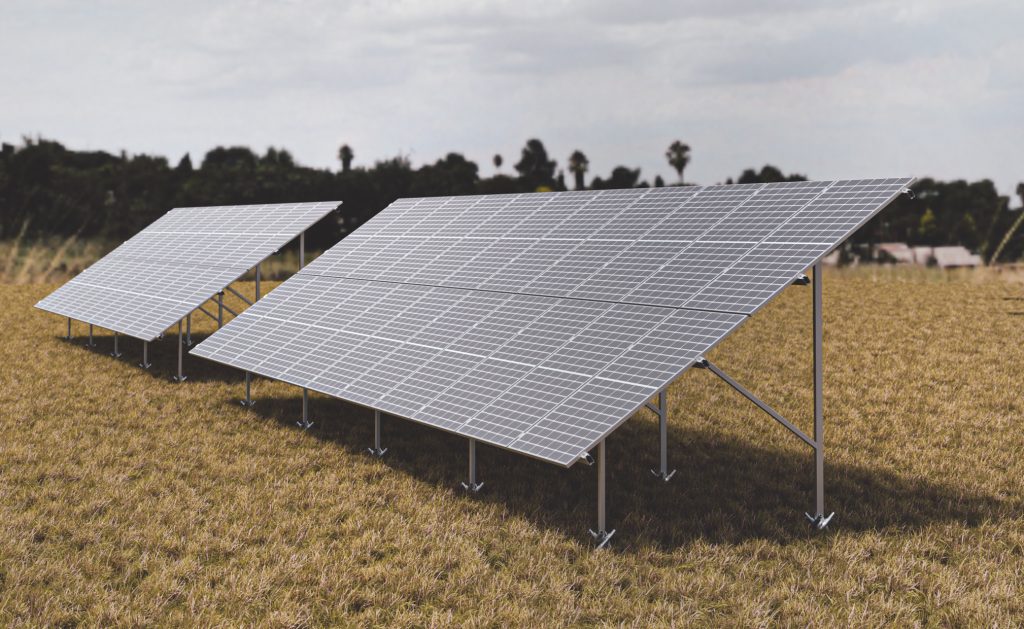 REKOSOL ground-mounted solar structure carrying rows of modules in an open field